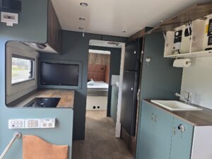 2024 ERV Retreat Internal Long View to Bed Find My Van – Caravan Broker – Caravan for Sale NSW Australia